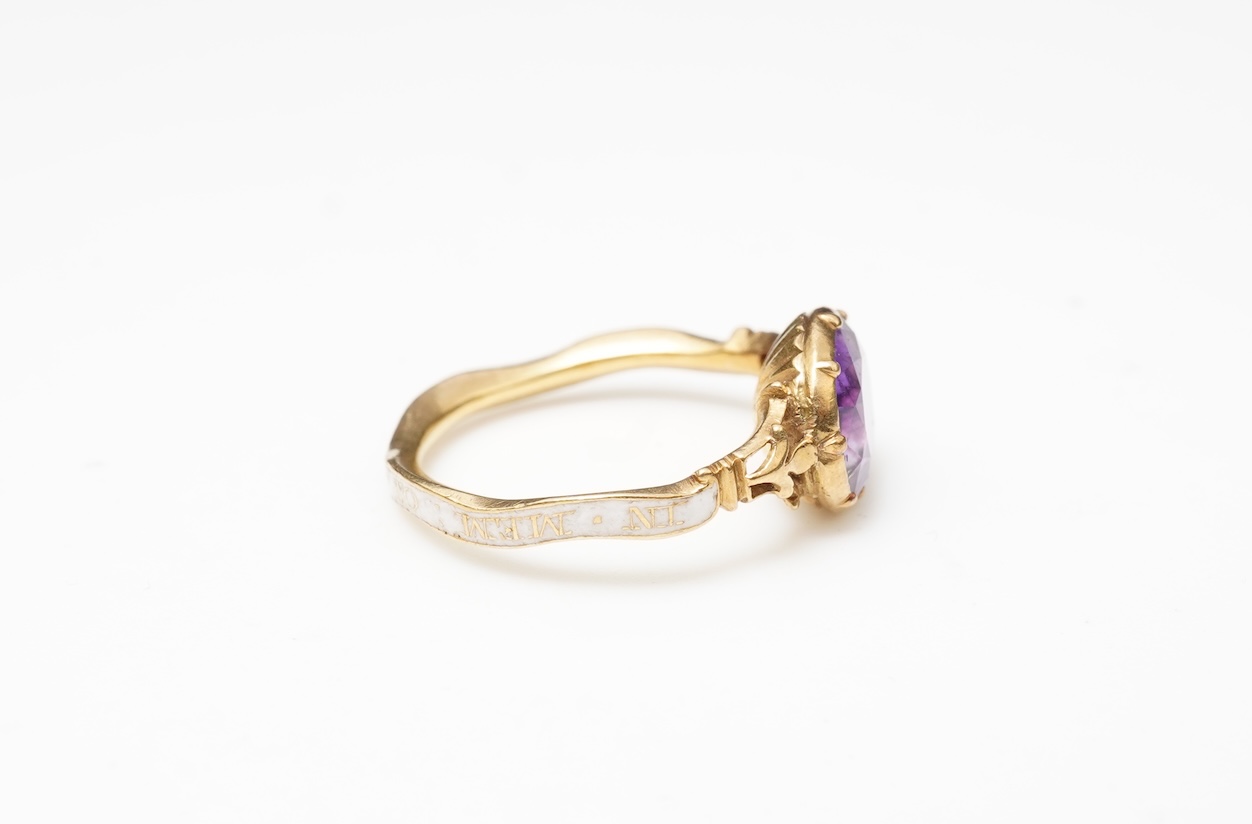 A rare and unusual George III amethyst and enamel mourning ring, late 18th century